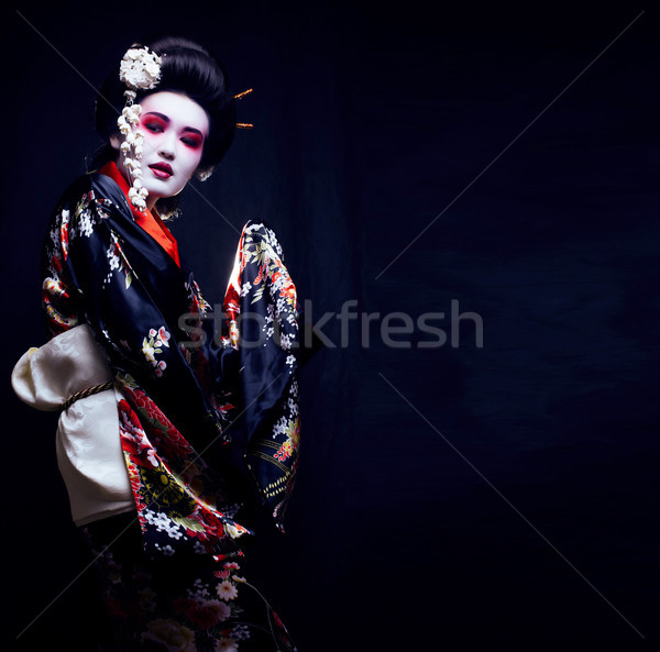 young pretty geisha in kimono with sakura and decoration Stock photo © iordani
