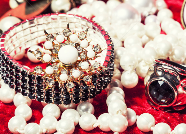 lot of jewellery close up in red velvet box, ring bracelet Stock photo © iordani