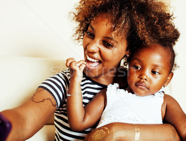 Stock photo: adorable sweet young afro-american mother with cute little daugh