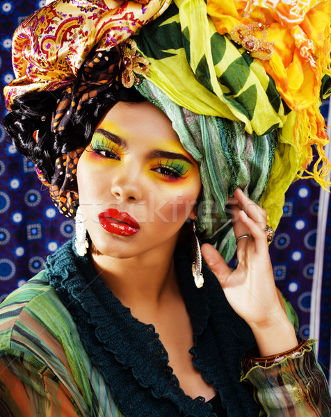 beauty bright woman with creative make up, many shawls on head like cubian woman Stock photo © iordani