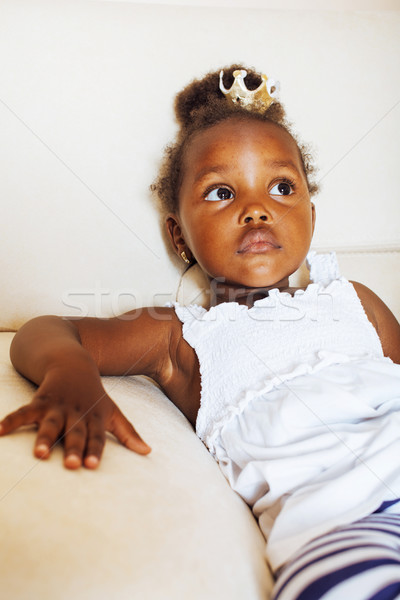 little pretty african american girl sitting in white chair weari Stock photo © iordani