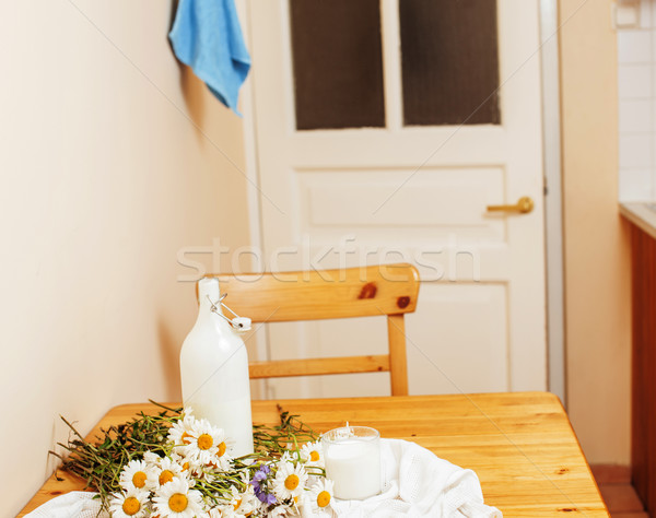 Simply stylish wooden kitchen with bottle of milk and glass on t Stock photo © iordani