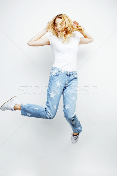 young pretty blond girl jumping isolated on white background, lifestyle flying people concept  Stock photo © iordani