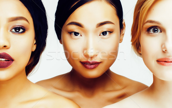 three different nation woman: asian, african-american, caucasian together isolated on white backgrou Stock photo © iordani