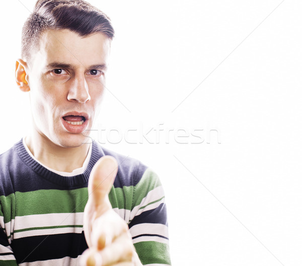 Portrait of a smart serious young man standing against white bac Stock photo © iordani