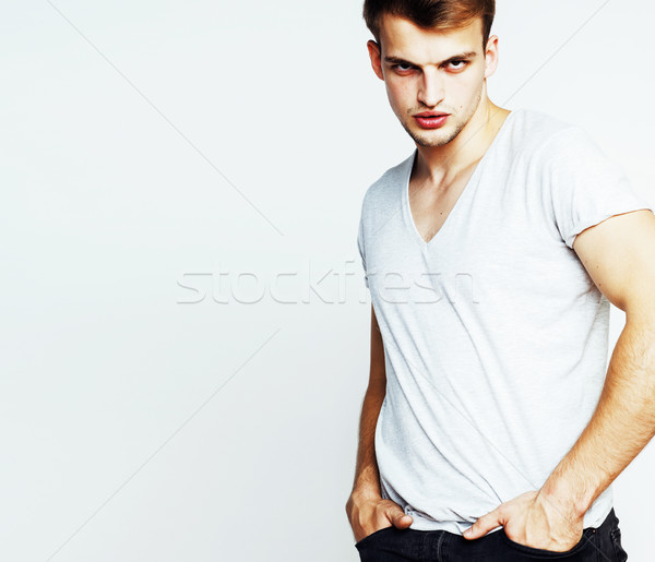 young handsome teenage hipster guy posing emotional, happy smiling against white background isolated Stock photo © iordani