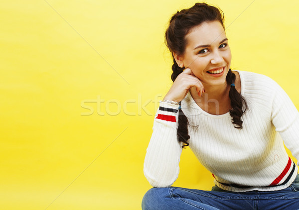 lifestyle people concept: pretty young school teenage girl having fun happy smiling on yellow backgr Stock photo © iordani