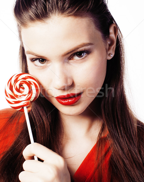 Stock photo: young pretty brunette girl with red candy posing on white backgr