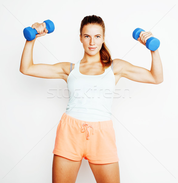 Stock photo: young pretty slim blond woman with dumbbell isolated cheerful smiling, measuring herself, diet peopl