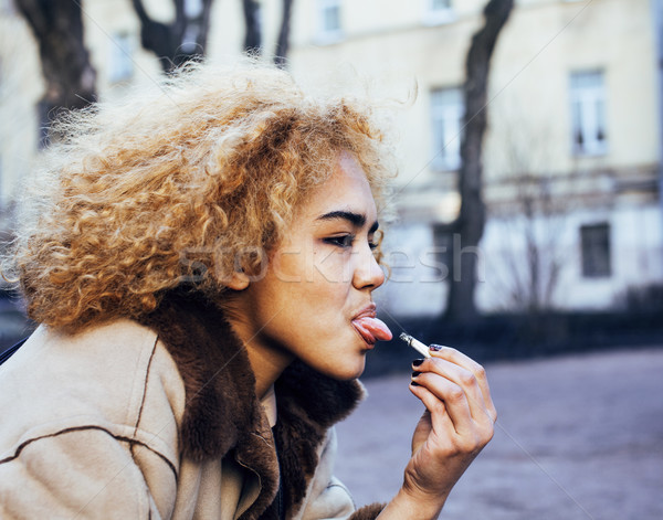 Jeunes joli fille adolescent à l'extérieur fumer [[stock_photo]] © iordani