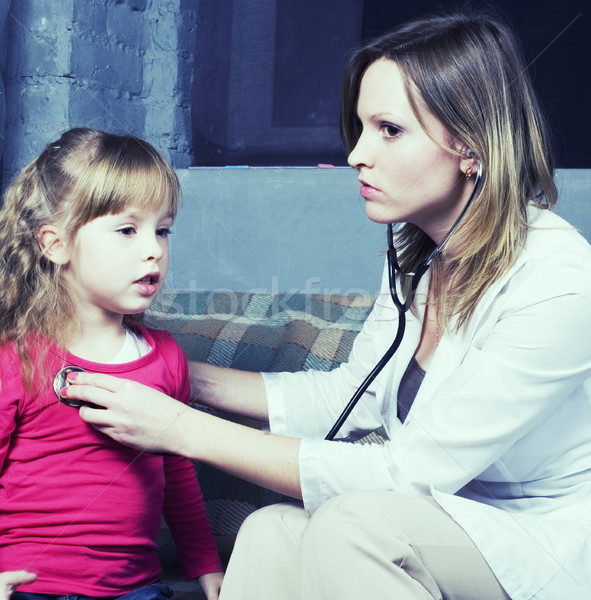 young doctor with little girl patient feeling bad medical inspection Stock photo © iordani