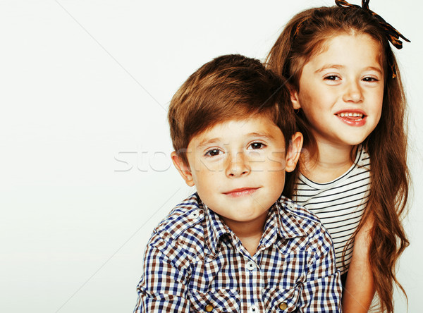 Stock photo: little cute boy and girl hugging playing on white background, ha