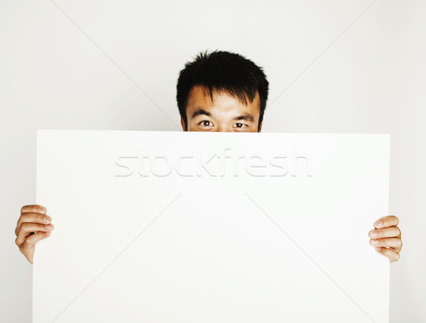 pretty cool asian man holding empty white plate smiling Stock photo © iordani
