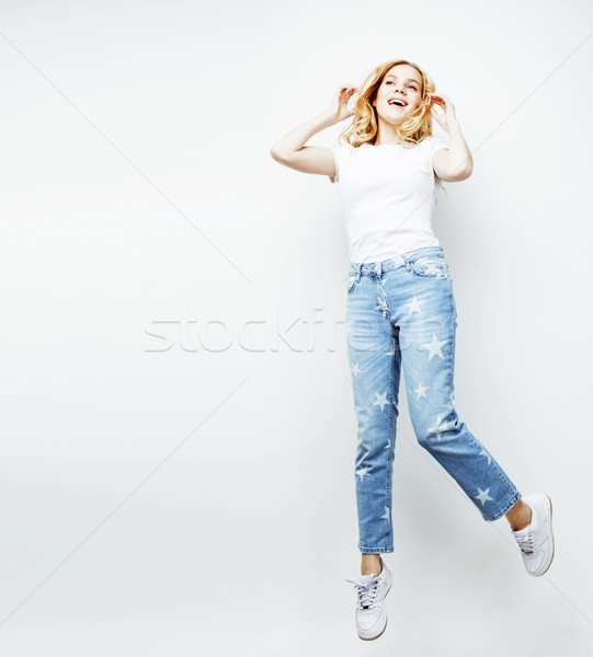 young pretty blond girl jumping isolated on white background, lifestyle flying people concept  Stock photo © iordani
