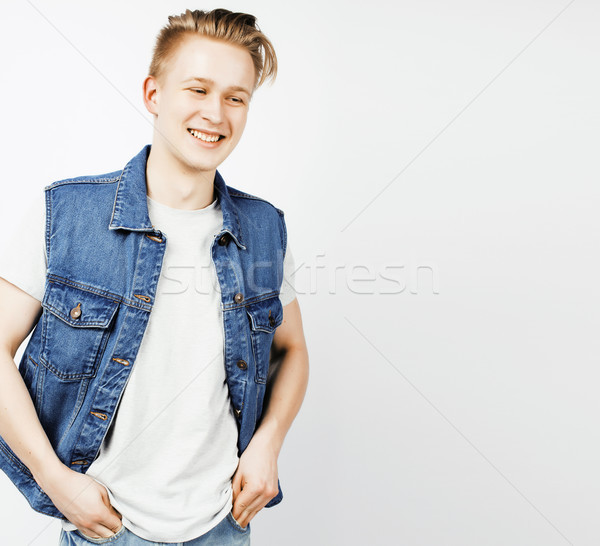 Stock photo: young handsome teenage hipster guy posing emotional, happy smiling against white background isolated