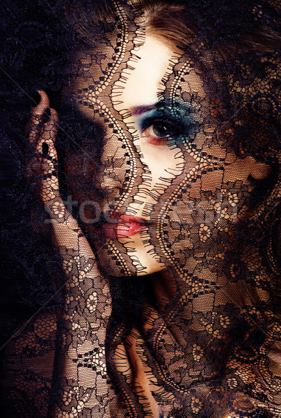 portrait of beauty young woman through lace close up mistery mak Stock photo © iordani
