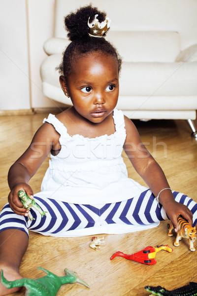 Little Cute African American Girl Playing With Animal Toys