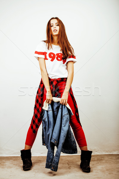 young pretty stylish hipster girl posing emotional isolated on white background happy smiling cool s Stock photo © iordani