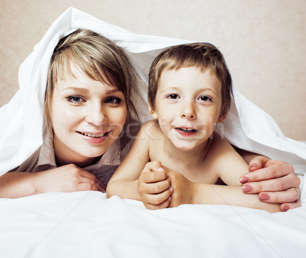 young blond woman with little boy in bed, mother and son, happy familyyoung blond woman with little  Stock photo © iordani