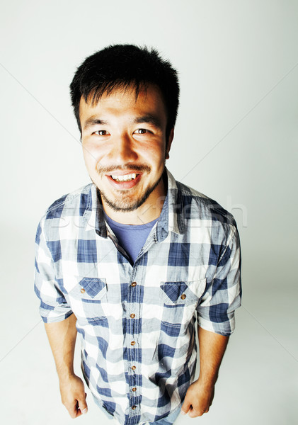 young cute asian man on white background gesturing emotional, po Stock photo © iordani