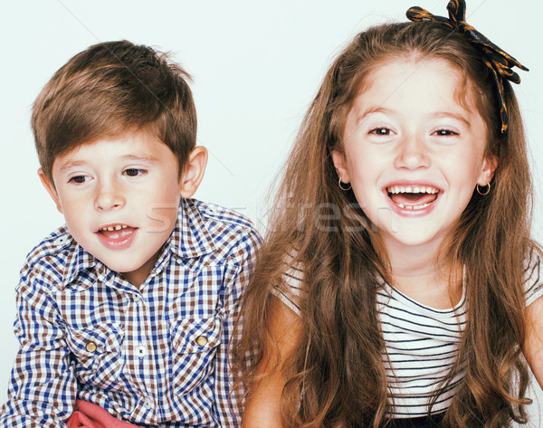 little cute boy and girl hugging playing on white background, ha Stock photo © iordani
