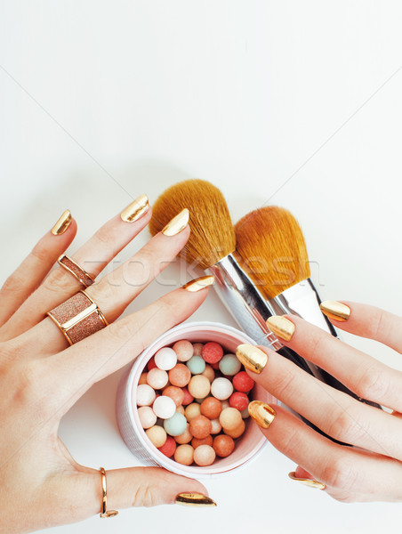 Vrouw handen gouden manicure veel ringen Stockfoto © iordani