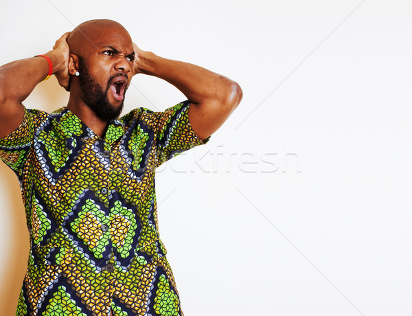 portrait of young handsome african man wearing bright green nati Stock photo © iordani