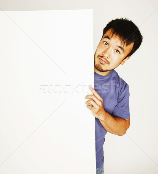 pretty cool asian man holding empty white plate smiling Stock photo © iordani
