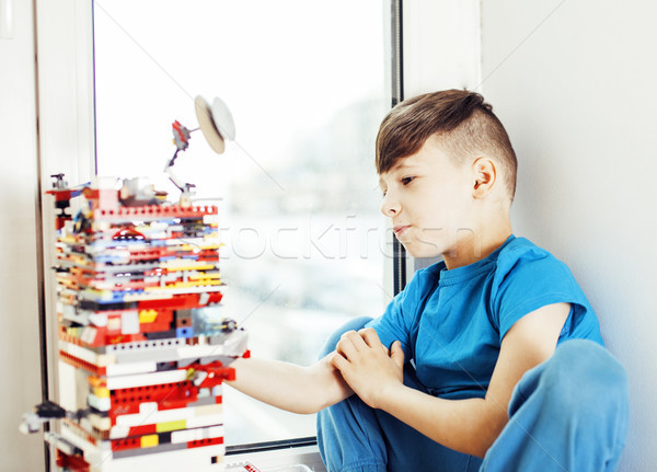 little cute preschooler boy playing lego toys at home happy smil Stock photo © iordani