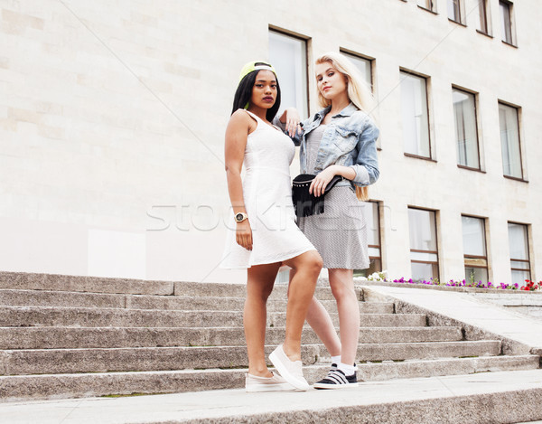 Two teenage girls infront of university building smiling, having fun traveling europe, lifestyle peo Stock photo © iordani