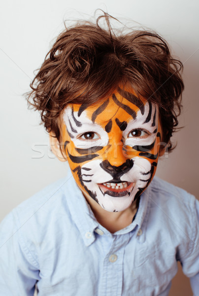 little cute boy with faceart on birthday party close up, little cute tiger Stock photo © iordani
