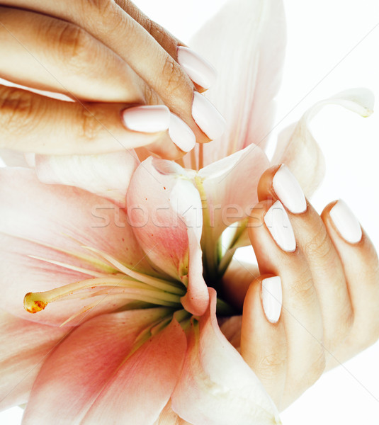 beauty delicate hands with manicure holding flower lily close up isolated on white Stock photo © iordani