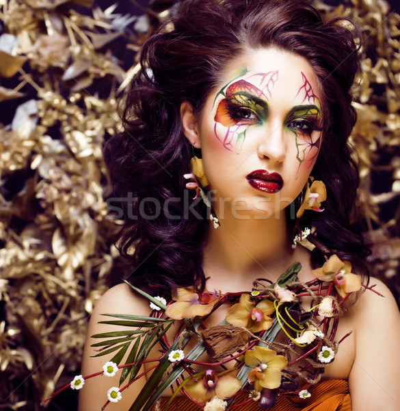 beauty woman with face art and jewelry from flowers orchids clos Stock photo © iordani