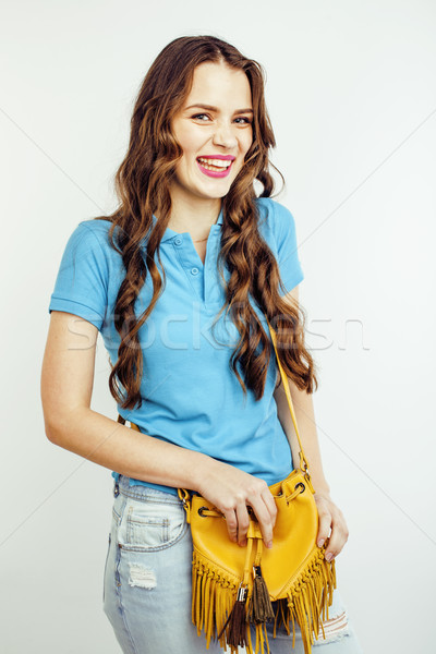 young pretty long hair woman happy smiling isolated on white background, wearing cute tiny handbag,  Stock photo © iordani