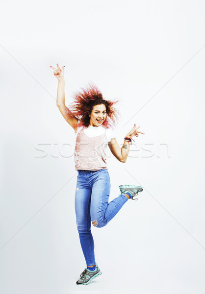 young pretty jumping mulatto woman posing cheerful emotional isolated on white background, lifestyle Stock photo © iordani
