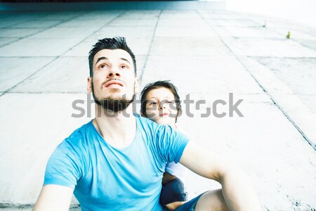 Young couple together making love, hugging. guy with tattoo, gir Stock photo © iordani