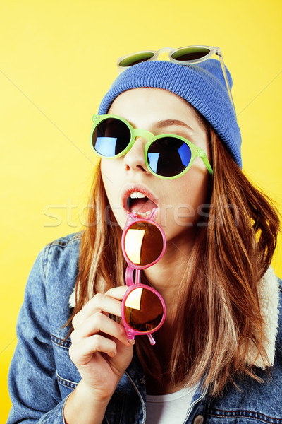 young pretty long hair teenage hipster girl posing emotional happy smiling on yellow background, lif Stock photo © iordani