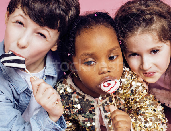 Stock photo: lifestyle people concept: diverse nation children playing together, caucasian boy with african littl