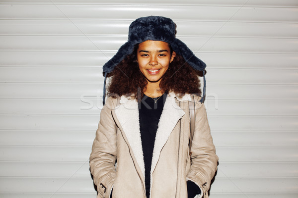 young pretty african american girl teenage outside on street, looking like real junky, social issues Stock photo © iordani