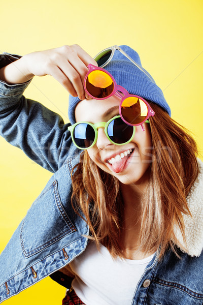 Stock photo: young pretty teenage hipster girl posing emotional happy smiling on white background, lifestyle peop