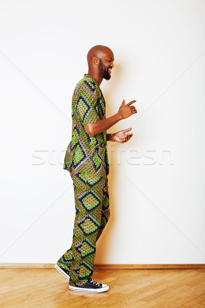 Stock photo: portrait of young handsome african man wearing bright green nati