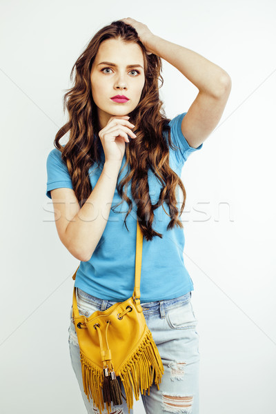young pretty long hair woman happy smiling isolated on white background, wearing cute tiny handbag,  Stock photo © iordani