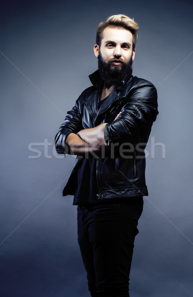 portrait of young bearded hipster guy on gray dark background close up, brutal modern man, lifestyle Stock photo © iordani