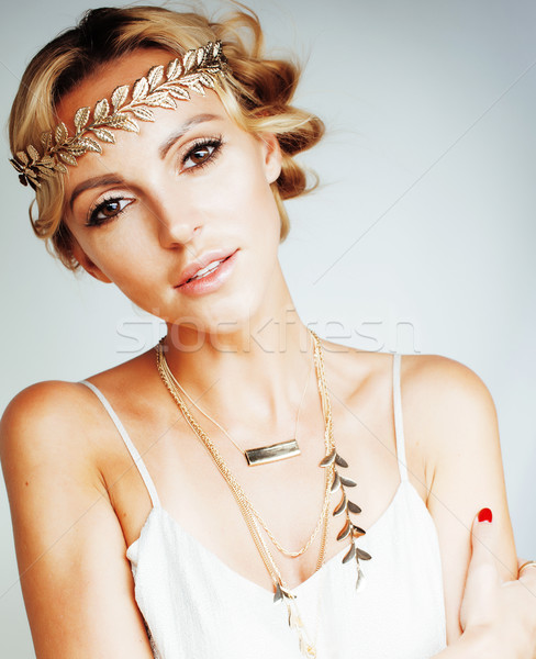 young blond woman dressed like ancient greek godess, gold jewelr Stock photo © iordani