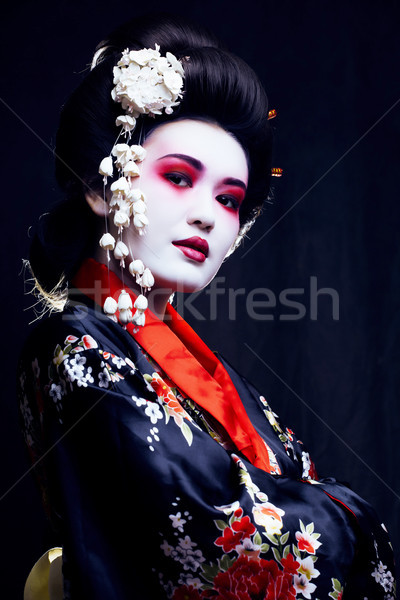 young pretty geisha in kimono with sakura and decoration Stock photo © iordani