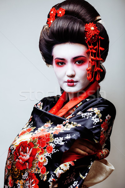 young pretty geisha in black kimono among sakura, asian ethno Stock photo © iordani