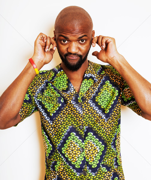 Stock photo: portrait of young handsome african man wearing bright green nati