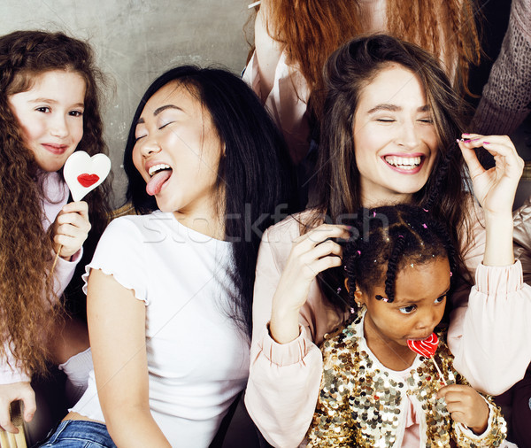 Lifestyle and people concept: young pretty diversity nations woman with different age children celeb Stock photo © iordani