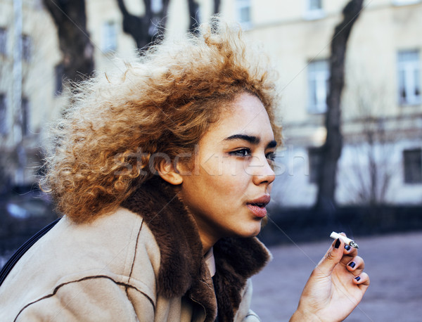 young pretty girl teenage outside smoking cigarette close up, lo Stock photo © iordani