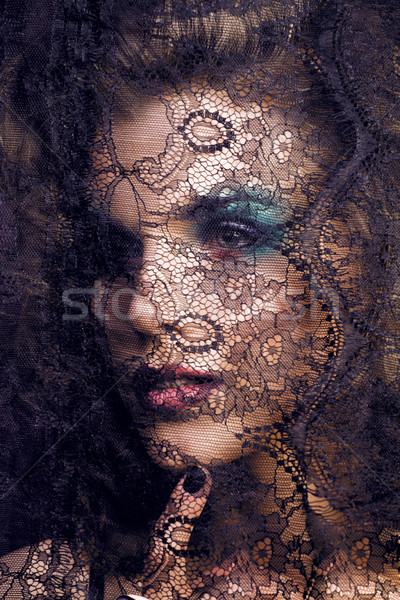 portrait of beauty young woman through lace close up mistery mak Stock photo © iordani